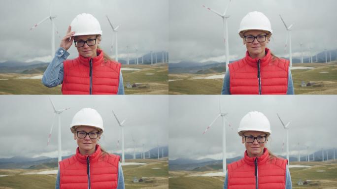 以风力发电厂为背景的年轻女性探险家