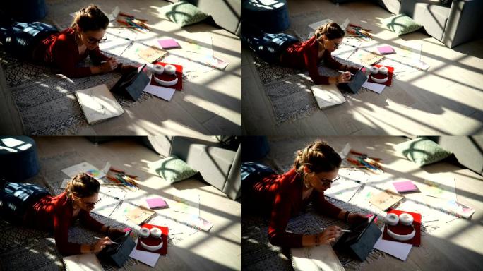 女孩在地板上画画钢笔住宅楼蜡笔