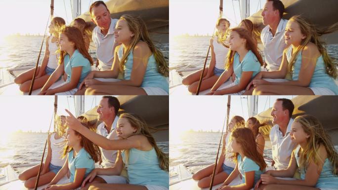 年轻的白人女孩和父母在游艇上航行
