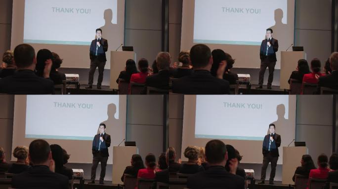 研讨会上观众为商人鼓掌