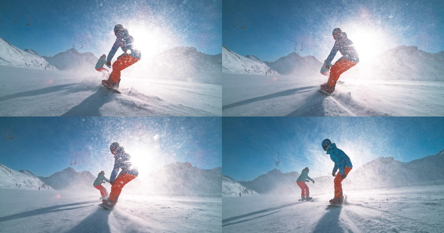 滑雪板运动员在阳光下沿着滑雪道滑行
