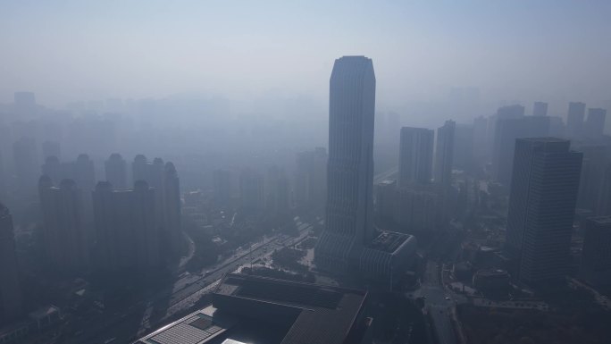 航拍雾霾天气城市建筑环绕镜头视频素材