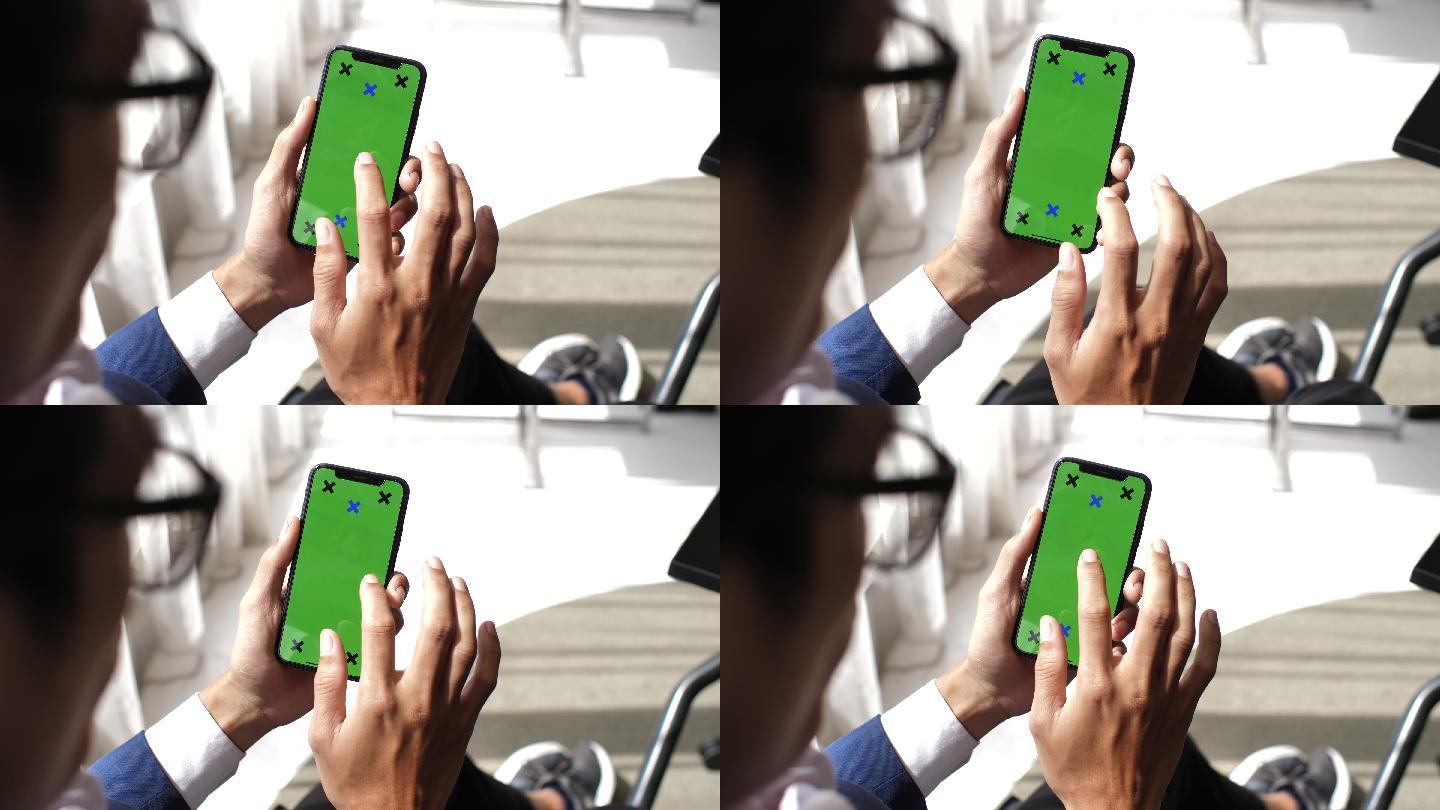 商人使用绿色屏幕手机