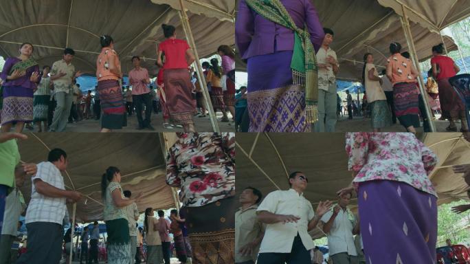老挝农村的农民跳舞庆祝传统节日
