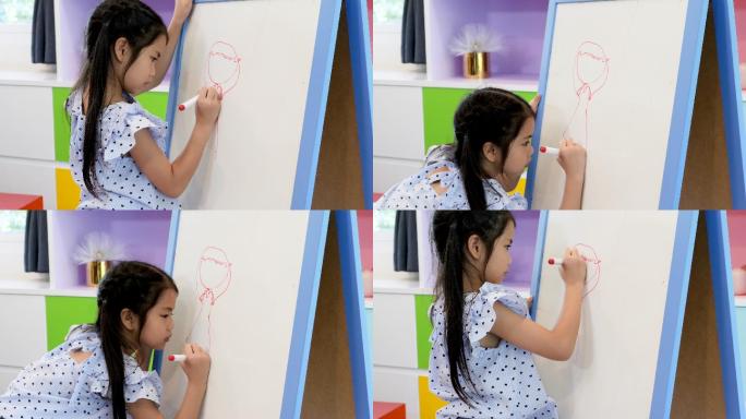 上课时女孩在黑板上画画