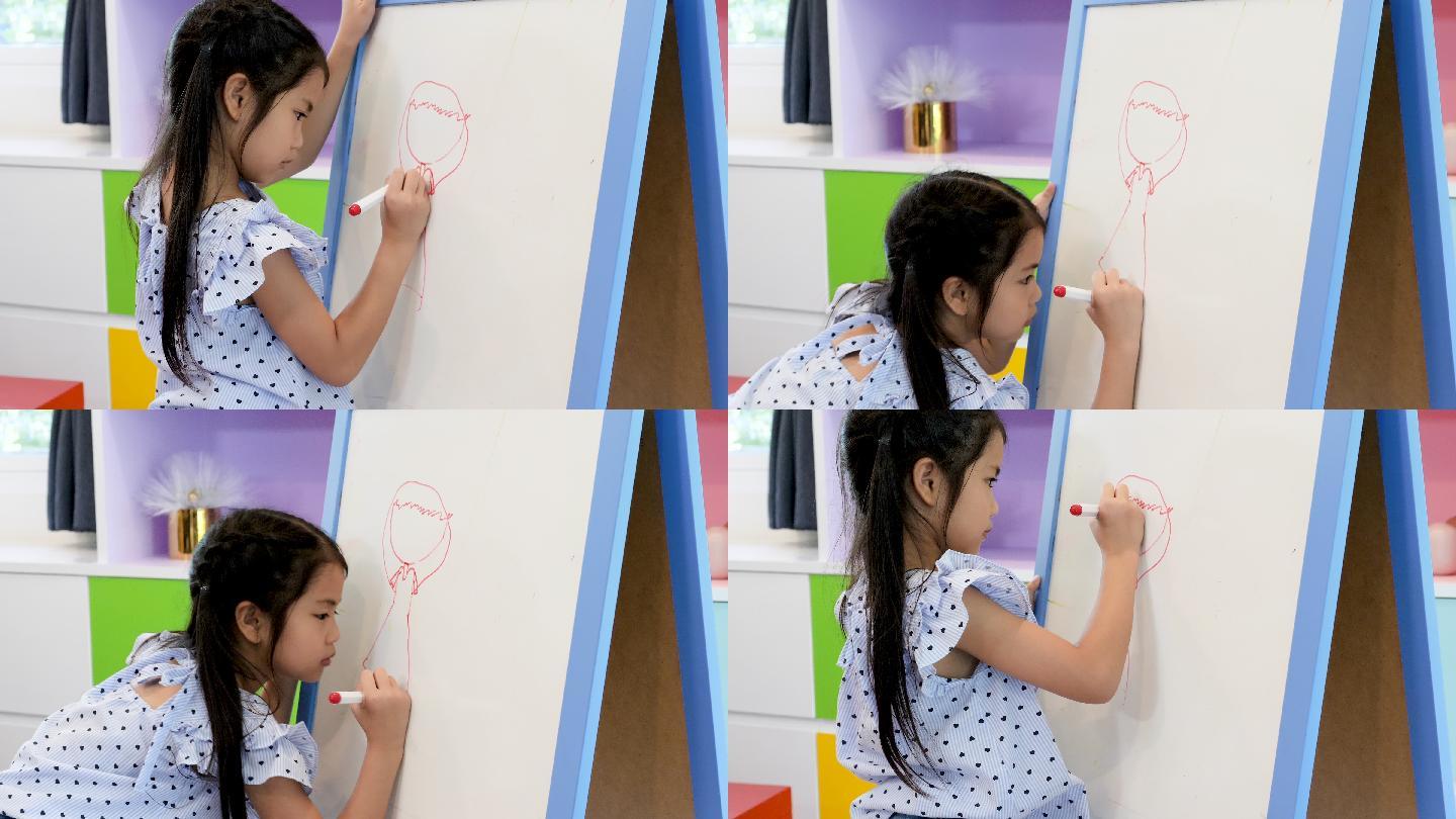 上课时女孩在黑板上画画