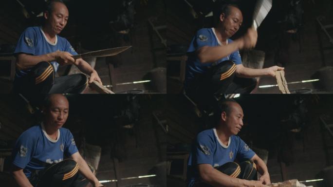 老挝农民劈劈柴烧火做饭