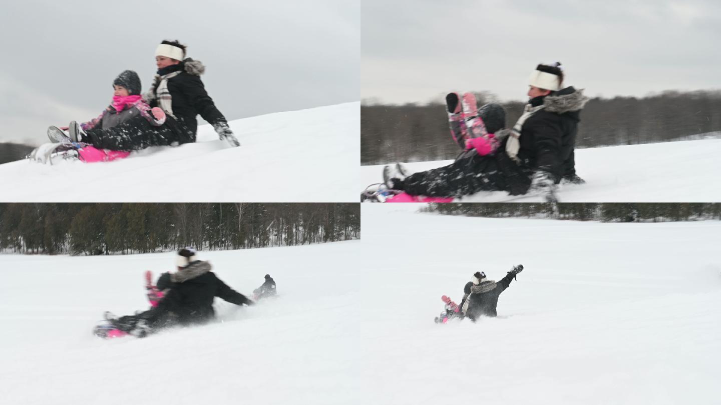 孙女和奶奶在雪山上玩冬季运动