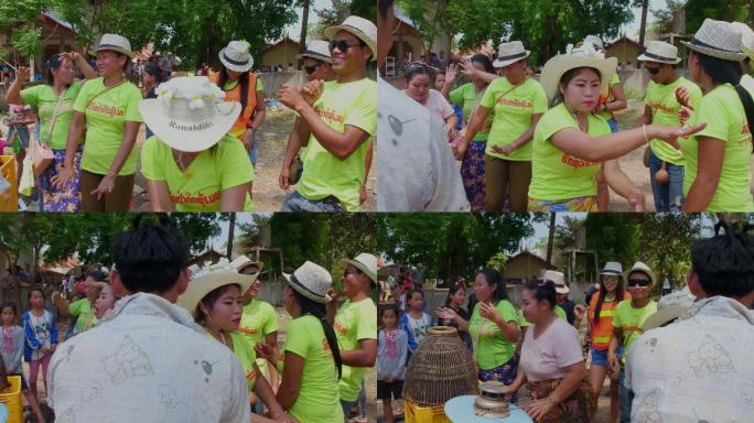 老挝农村的农民跳舞庆祝传统节日