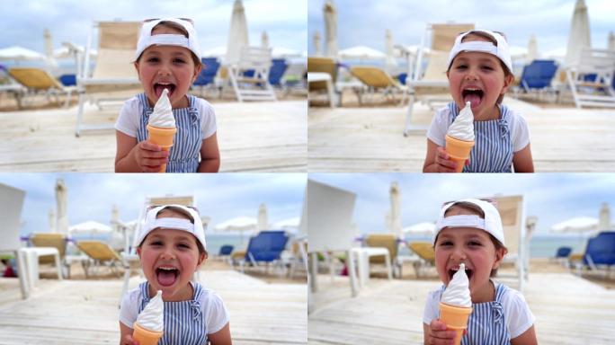快乐的孩子在海滩上舔香草冰淇淋