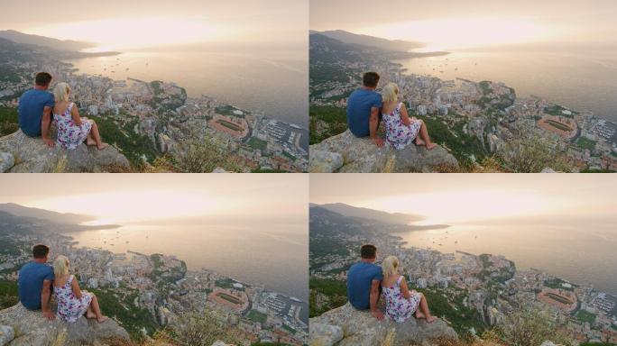 日落时分，一对夫妇正在欣赏摩纳哥的美景
