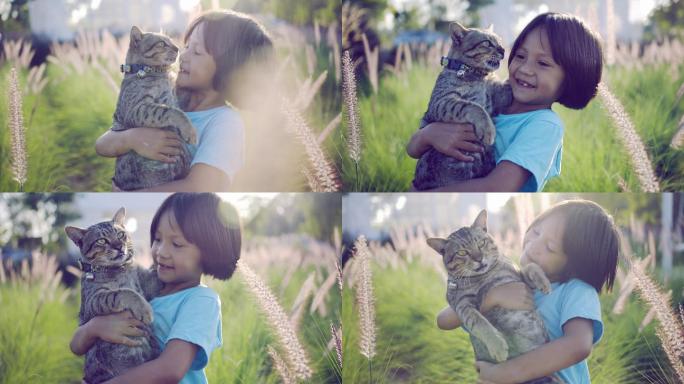 抱着猫咪的小女孩视频素材