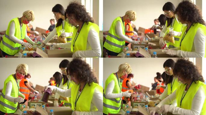 志愿者在仓库里收集捐赠的食物