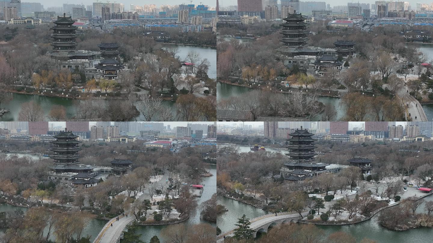 济南大明湖超然楼冬季下雪雪花城市航拍4k