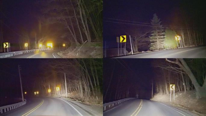 在乡村的公路上开车，在夜晚穿过山林。