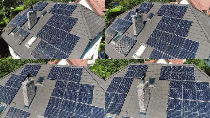 晴朗的蓝天和屋顶上的太阳能电池板