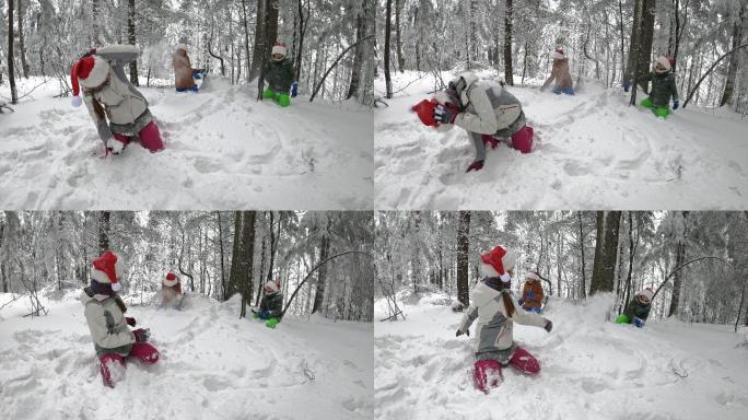 三个孩子穿着圣诞装打雪仗