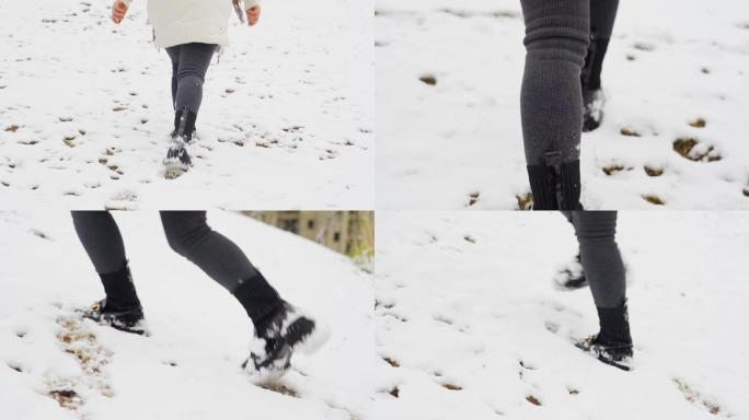 女生走在雪地上雪地行走脚印特写
