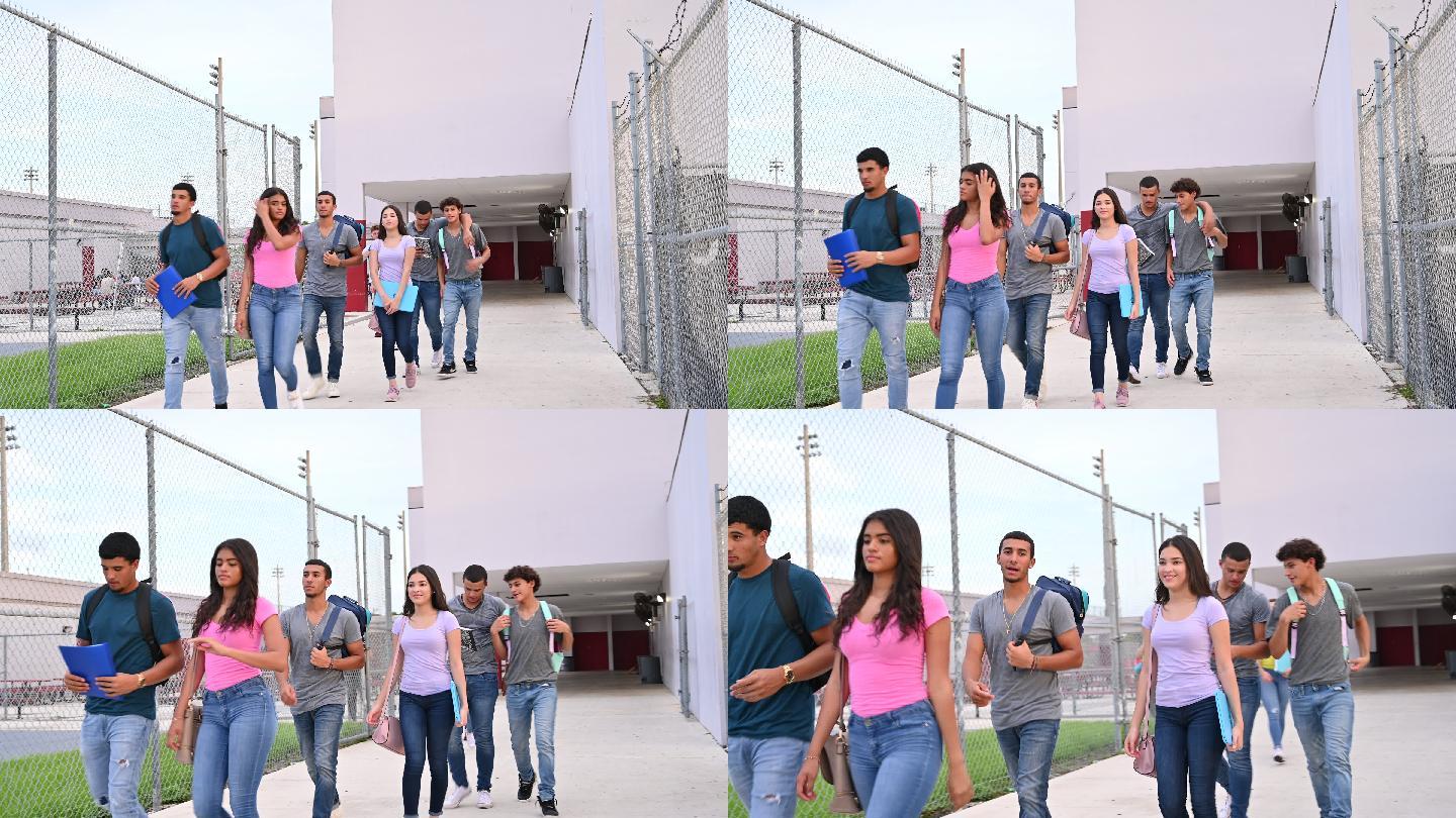 十几岁的学生在校外一起散步