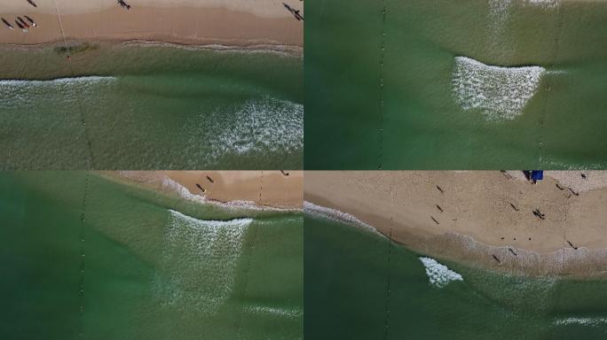航拍白色海浪涌向沙滩