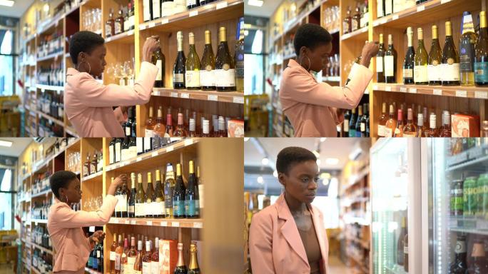 寻找葡萄酒的女人酒类超市买酒葡萄酒红酒超