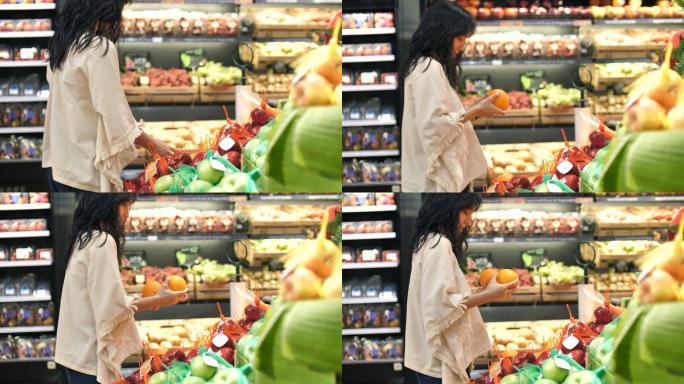 在超市挑选水果的女人