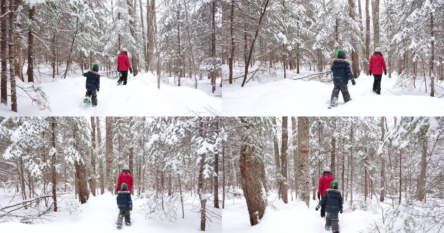 母亲和儿子冬天在雪地行走