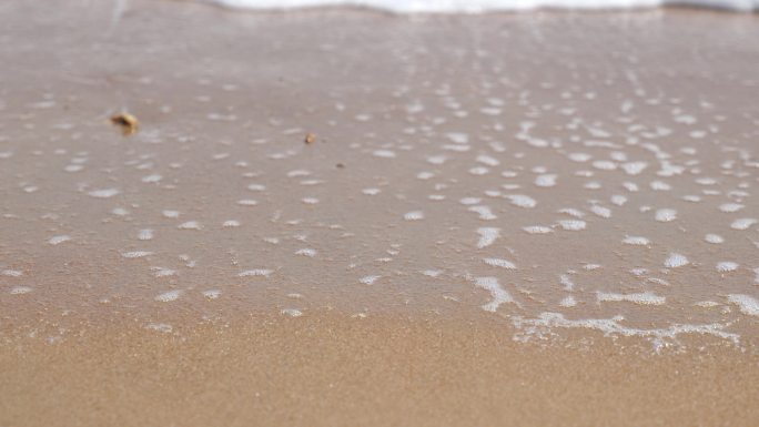 沙滩海水沙子浪花泡沫冲刷