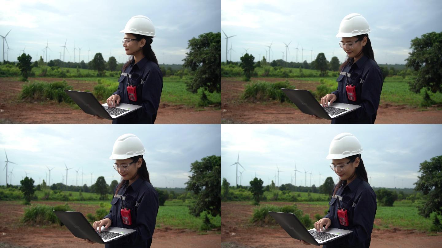 女性维护工程师在风力发电厂工作。