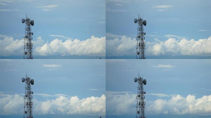白云蓝天背景的电信塔杆