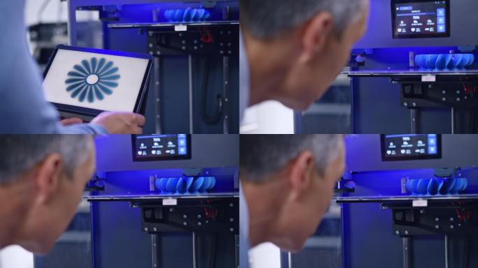 男工程师，站在3D打印机旁检查模型结构