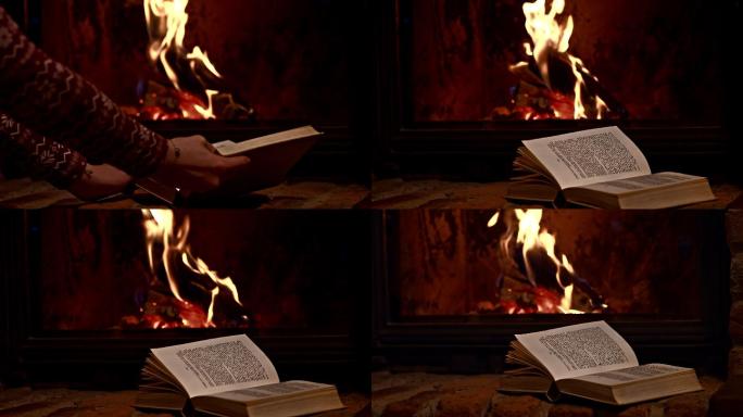在壁炉旁拿着一本书的女人