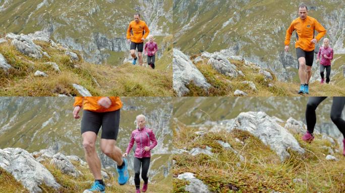 男、女跑步者在岩石覆盖的草地上爬山