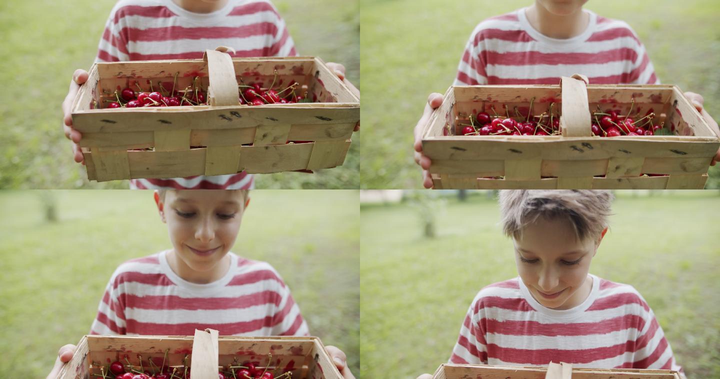 男孩向镜头展示樱桃