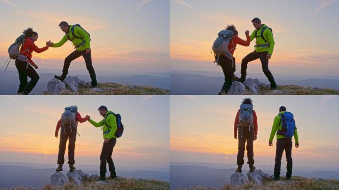 男女徒步旅行者日落时站在山顶