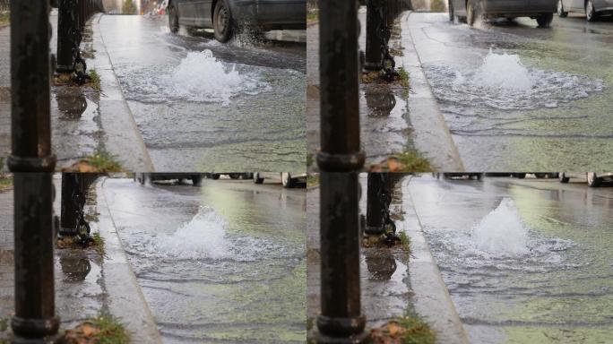 由于地下水管破裂，水从道路流出