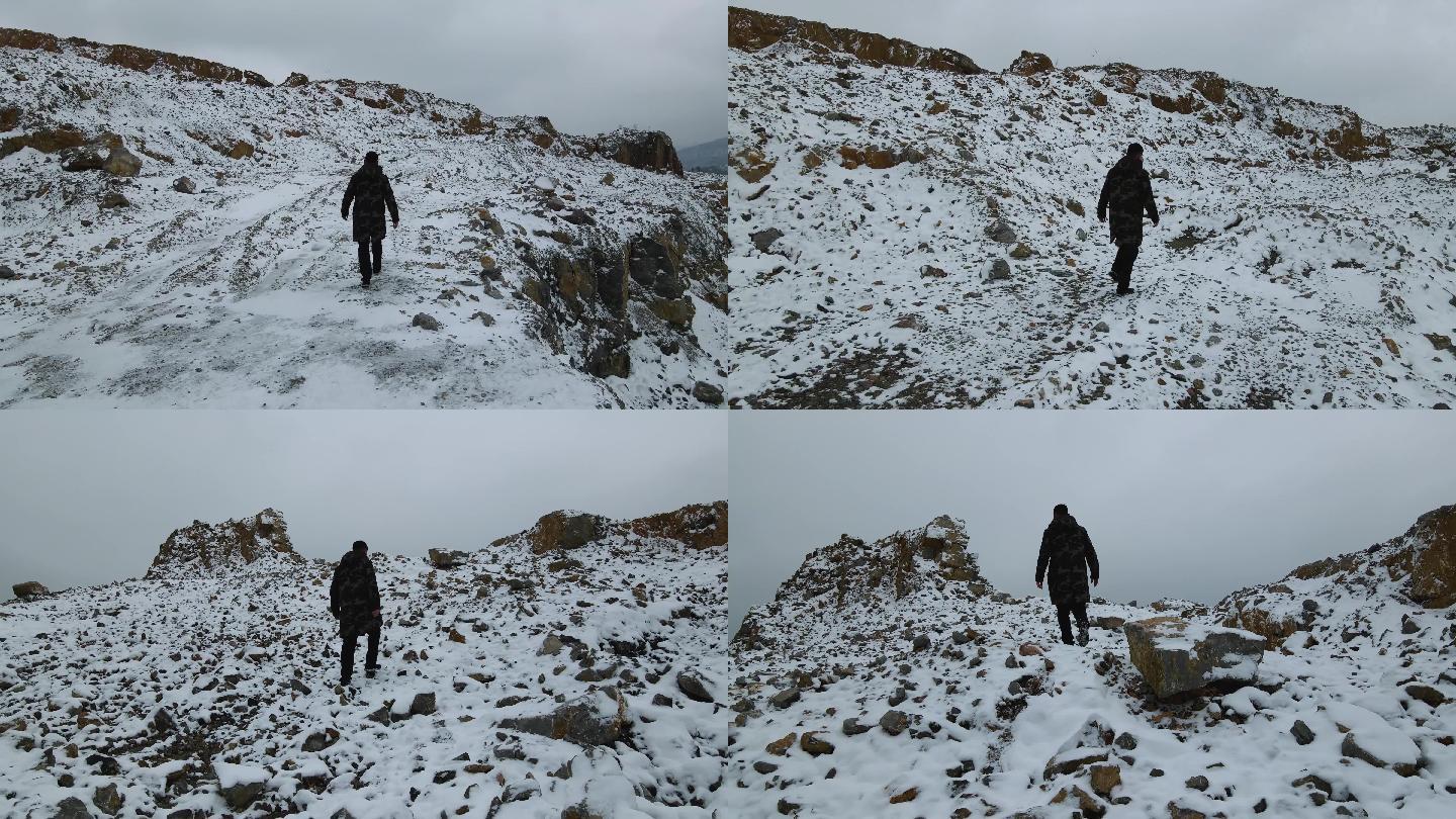 雪地行走男人背影登雪山成功登顶雪山雪景