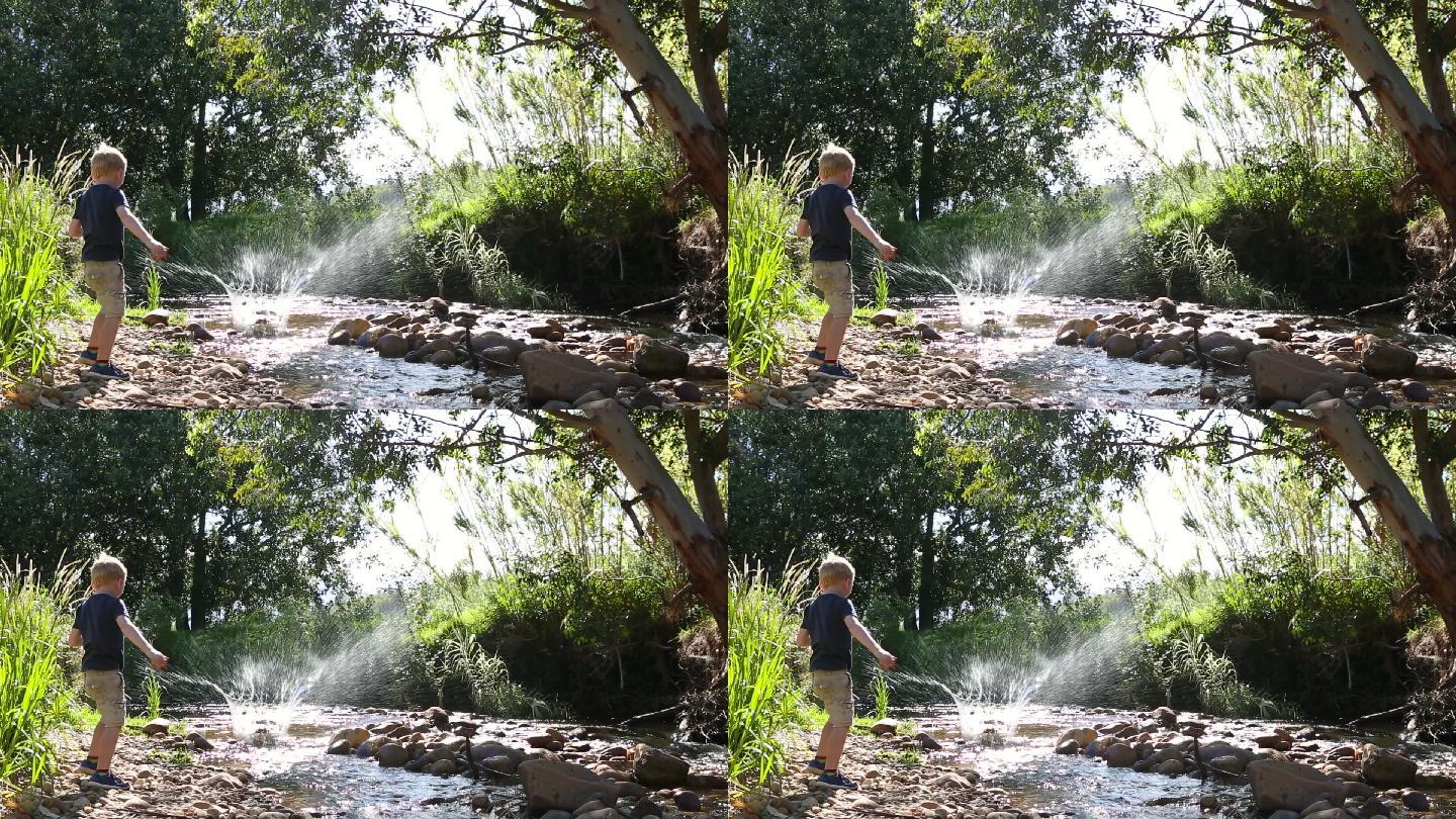 一个男孩向河里扔石头