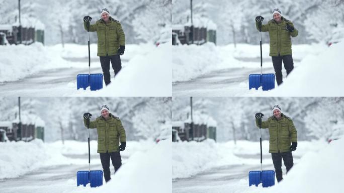 一名男子在铲雪雪冬季天气下雪