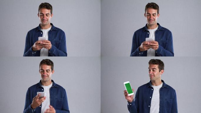 男子使用手机绿色屏幕可抠像