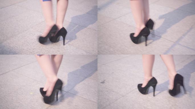 商业女性穿着高跟鞋走在街道上