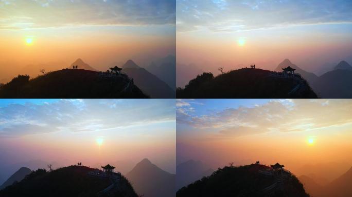 航拍日出日落一家三口站在山顶的温馨画面