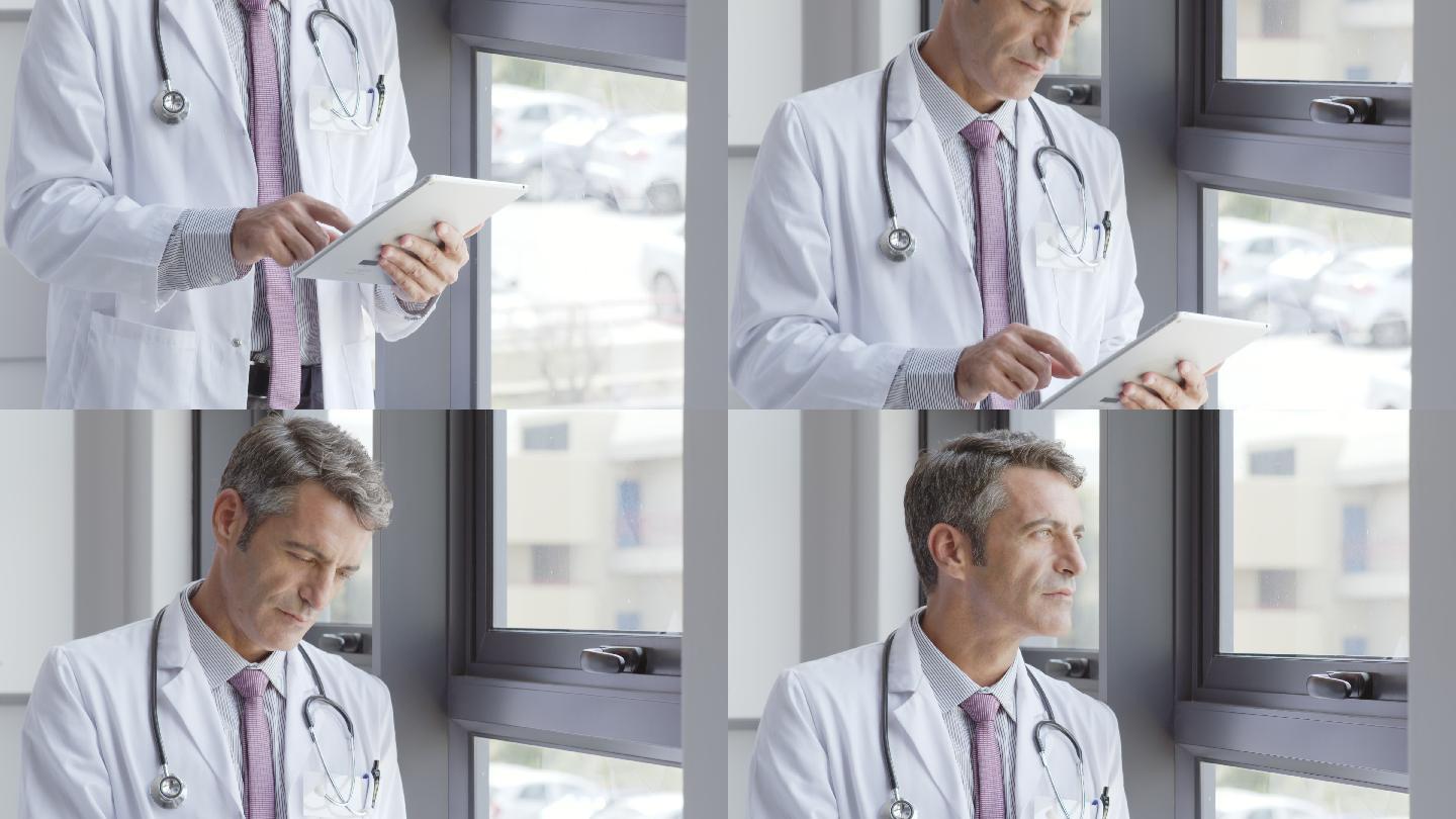 医生在医院窗口使用数字平板电脑