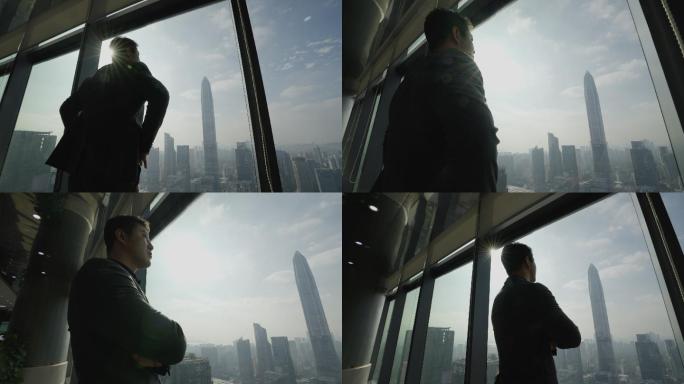 商务成功人士看向窗外平安大厦俯瞰深圳