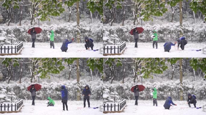 下雪天一家人开心打雪仗拍照
