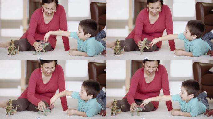 妈妈和小儿子在玩恐龙玩具