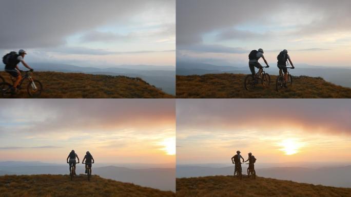在山顶骑车看风景登山骑行日出朝阳身影背影