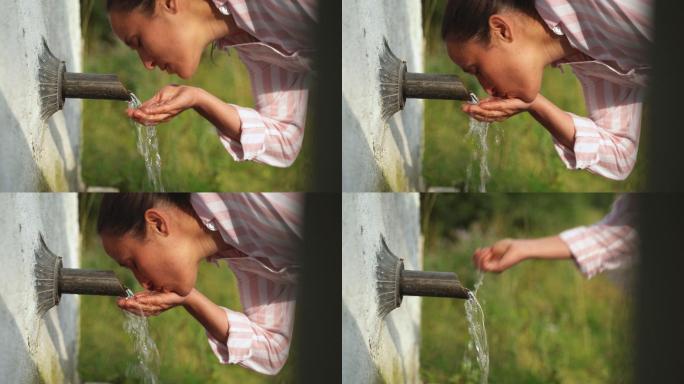 一个年轻女子在享受天然泉水的新鲜山水
