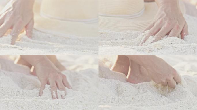 一名女子在沙滩上触摸白色沙滩