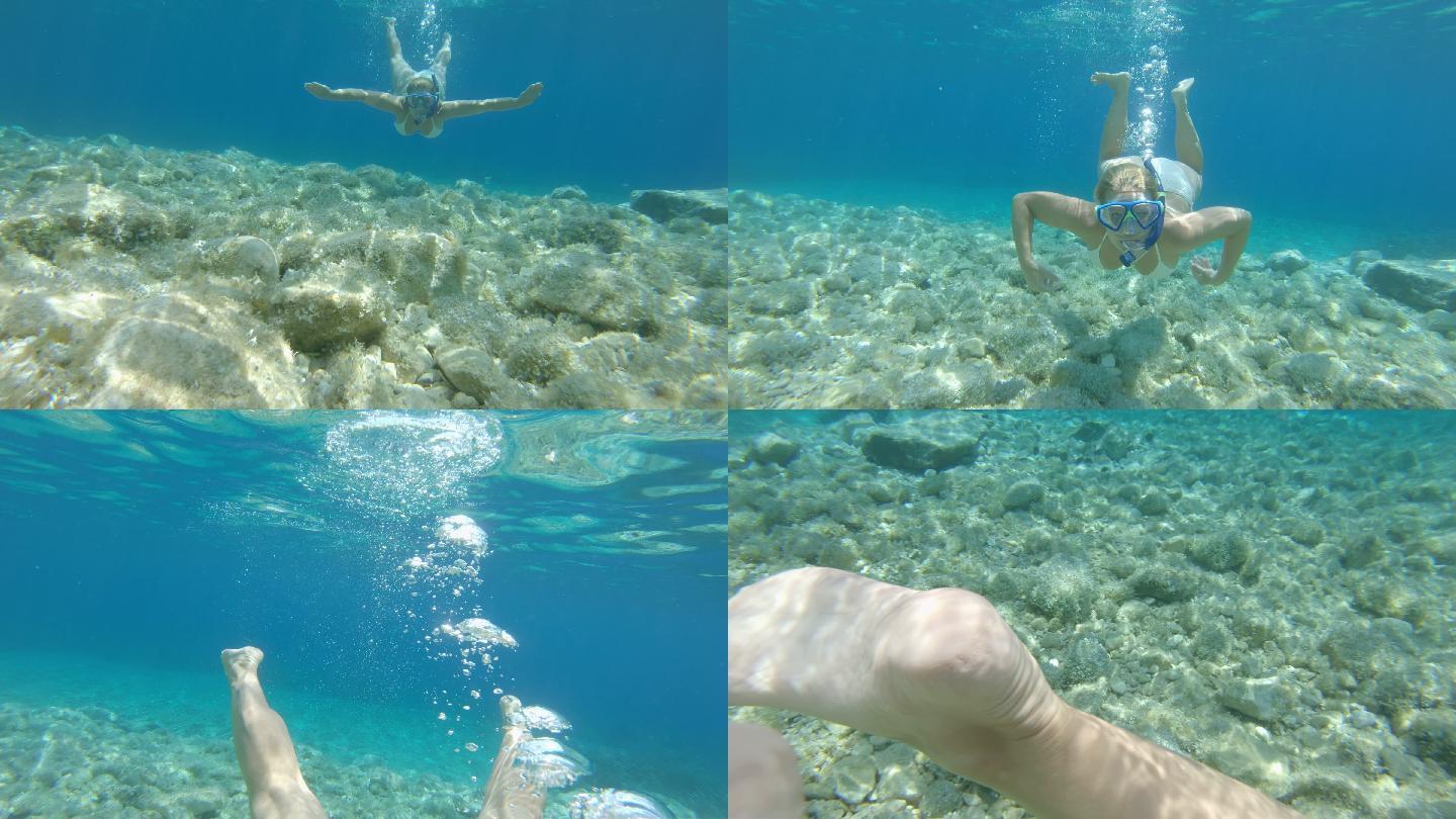 一名年轻女子在水下浮潜